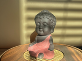 Budda, figurka  herbaciana, glina, 8x3.5 cm